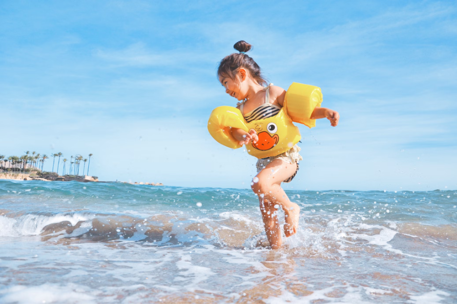 Child playing on the beach on a vacation